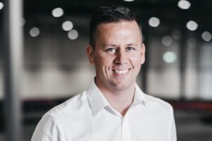 A portrait photo of a smiling Håvard Hallås, Group CCO ELement Logic.