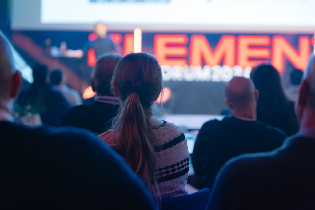 A picture of the audience look on stage at the presenter
