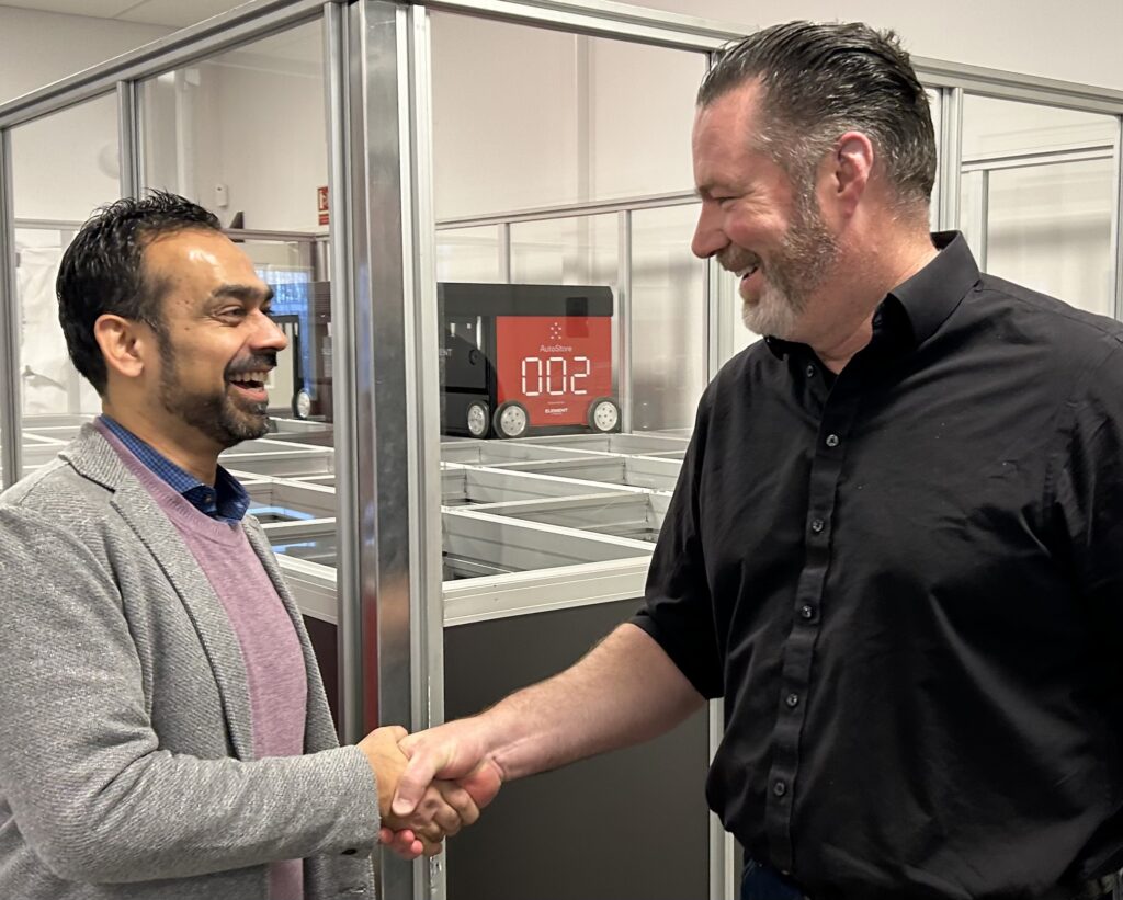 Matt Bell and Ankush Malhotra handshake