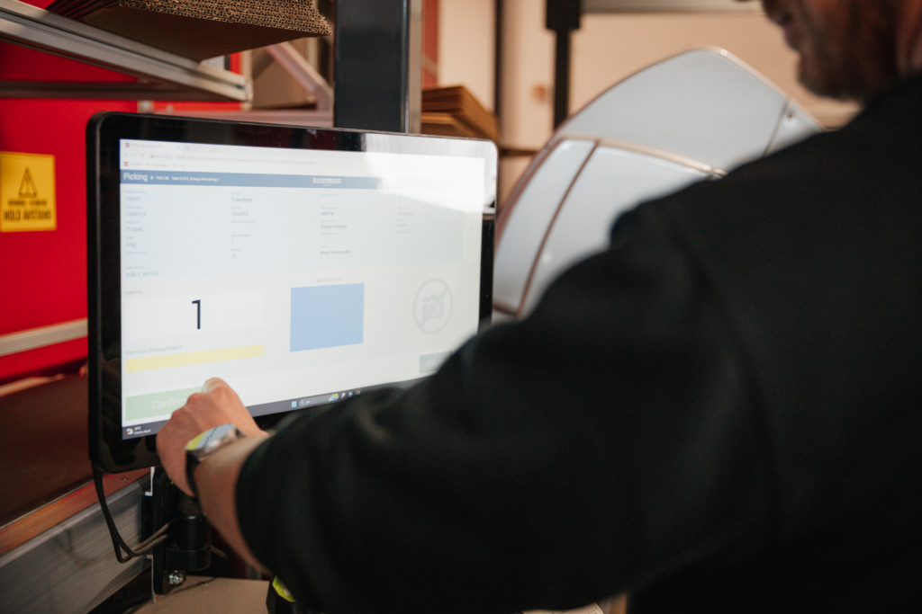 Person picking an order on screen