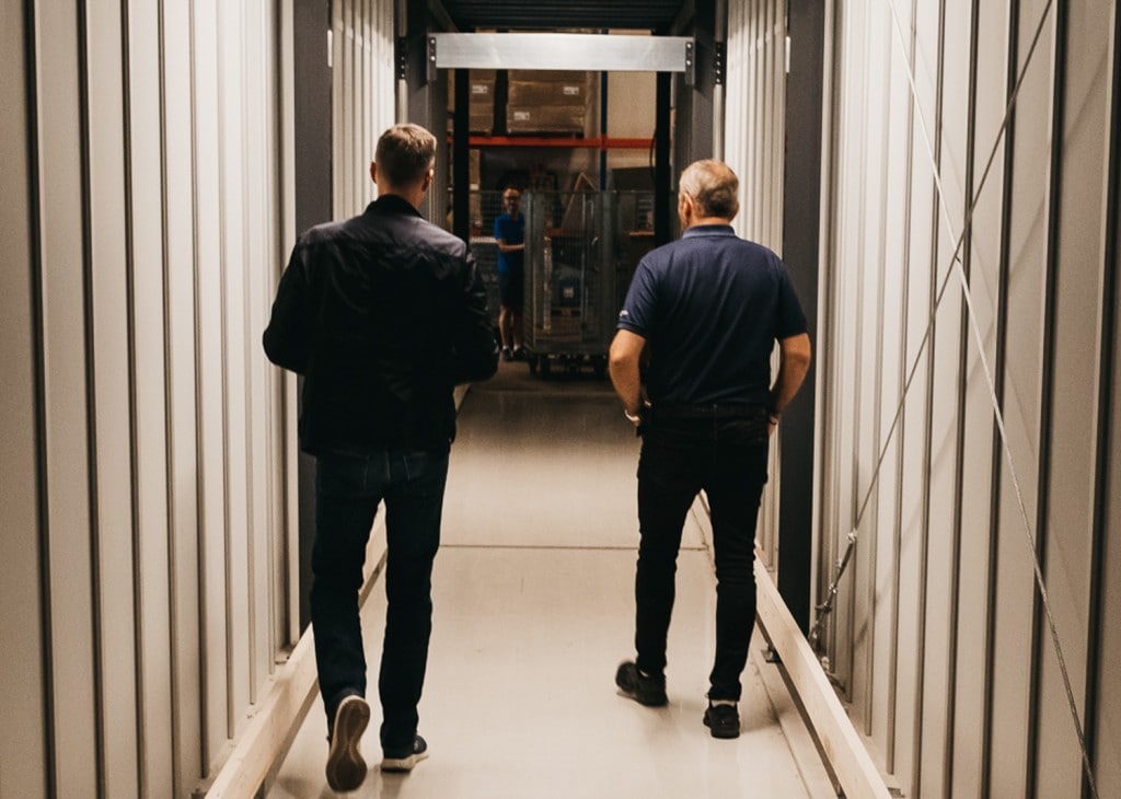 Founder, Trond Gule, and Element Logic Sales Manager, Øyvind Kollerud, walking through the custom-made tunnel through AutoStore in GS Bildeler Oslo warehouse